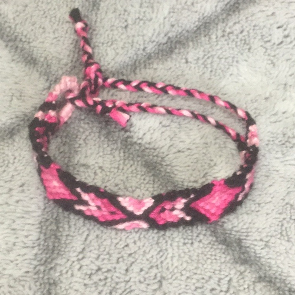 Pink and black friendship bracelet